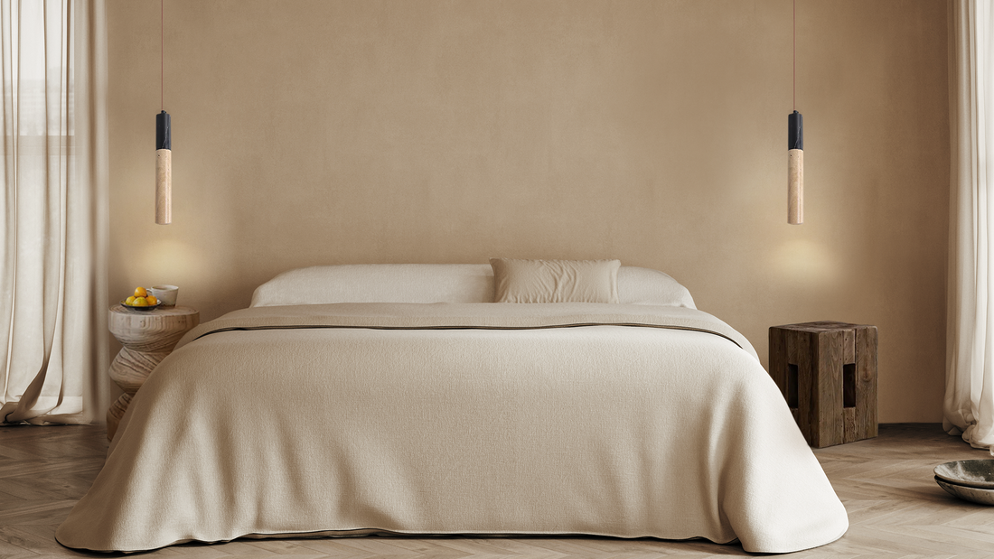 Serene, minimalistic bedroom with travertine pendant lamps and neutral colors