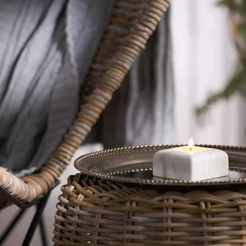 White square marble tealight on side table
