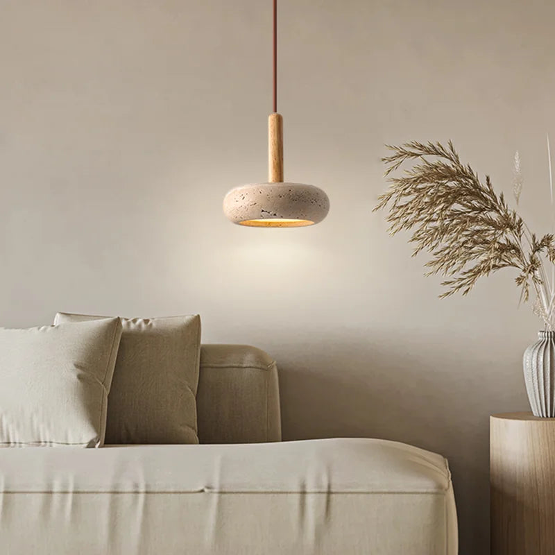 Travertine japandi pendant light hanging over couch, in neutral color living room