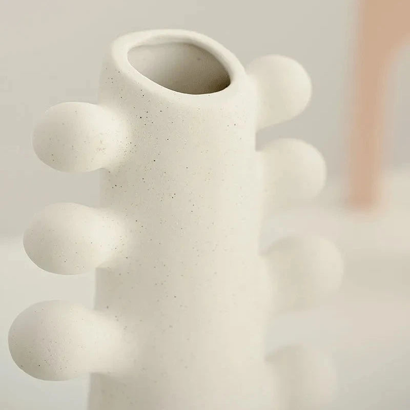 Details of white textured ceramic vase
with bubble design details on sides