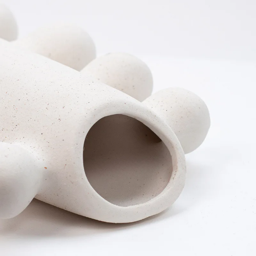 Details of white textured ceramic vase
with bubble design details on sides