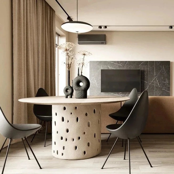 Japani living room with neutral colors and black textured vases on round table