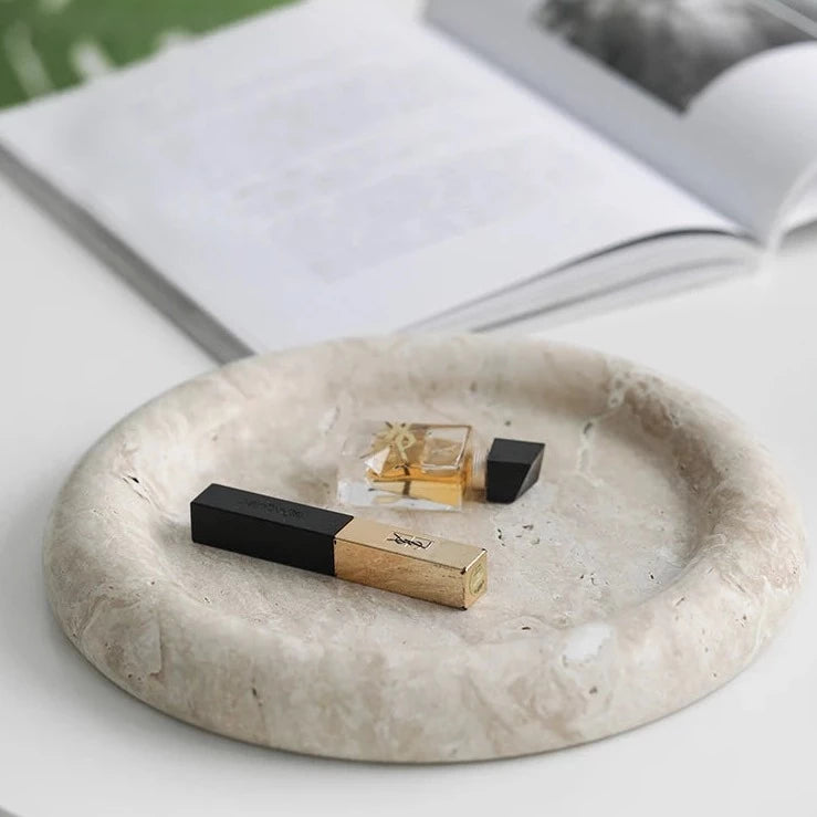 Round marble tray with book and perfume miniatures