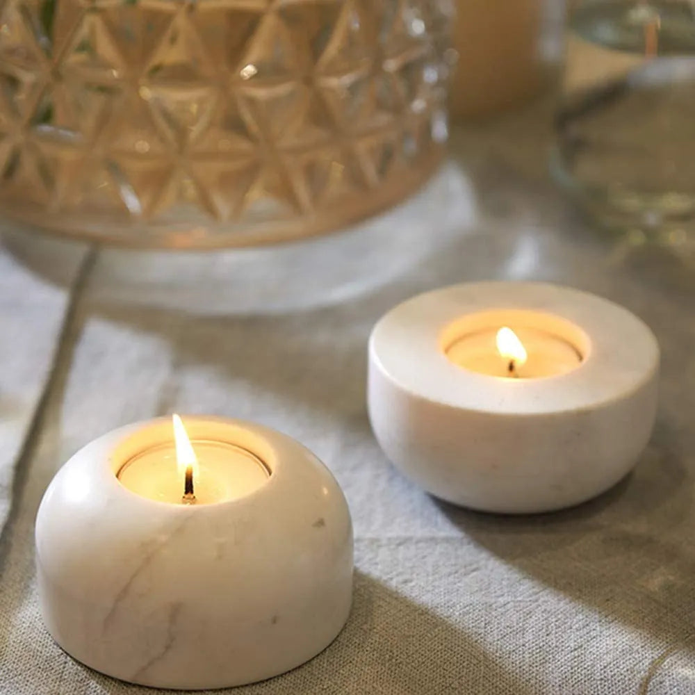 White round marble tealights on table