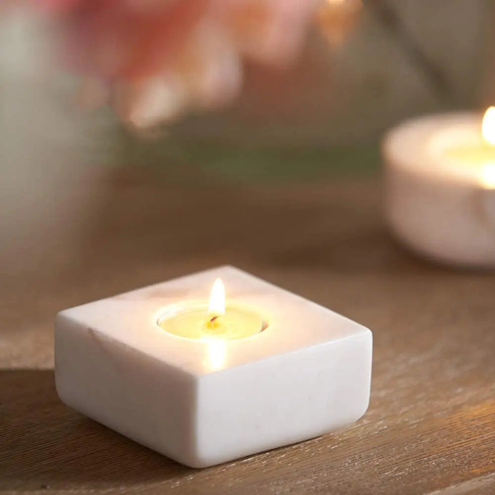 White square marble tealight on table