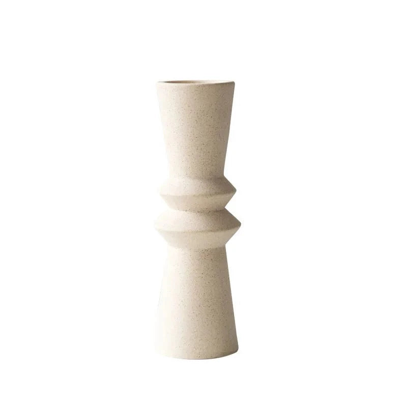 White ceramic candle holder on white background