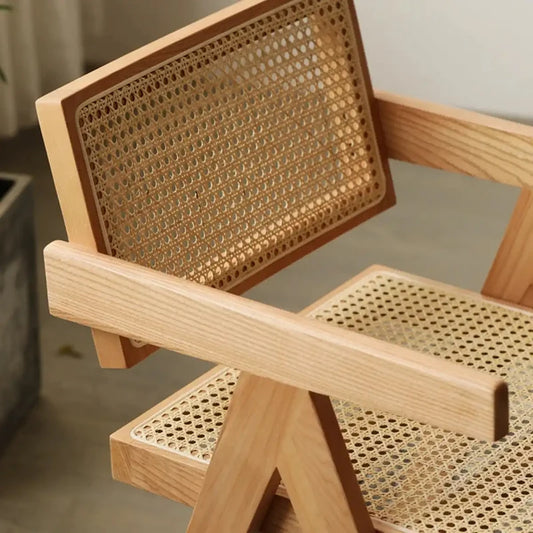 Detail of Japandi wood chair with rattan seat