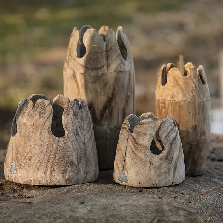 Set of four handcrafted japandi wooden vases outdoors