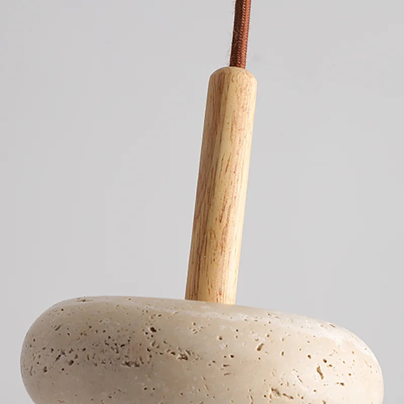 Detail of wood and cord insert in travertine japandi pendant light