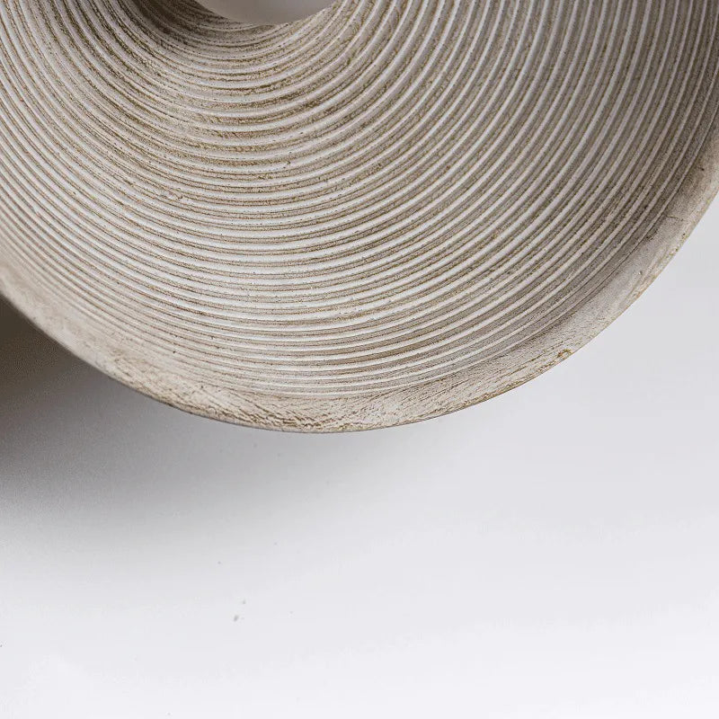 Detail of round Japandi wall lamp on neutral color background