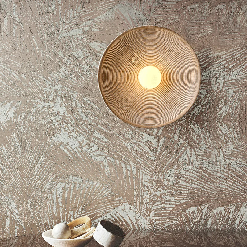 Round Japandi wall lamp over neutral color wallpaper