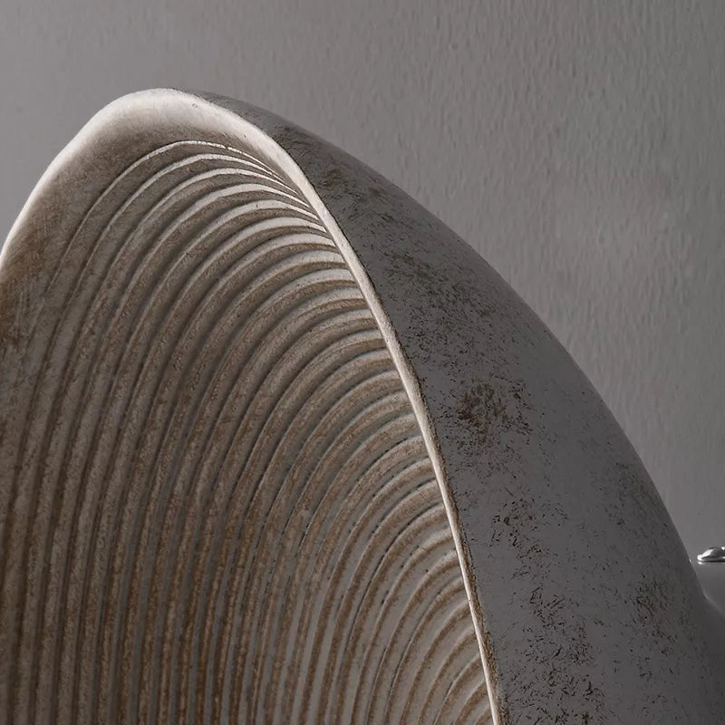 Detail of round Japandi wall lamp on neutral color background