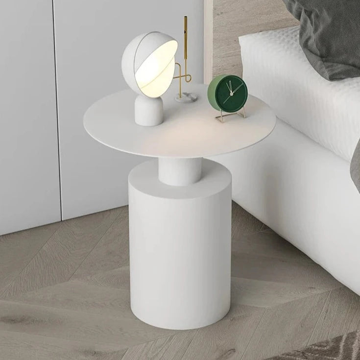 Sleek white lightweight metal side table in minimalist bedroom