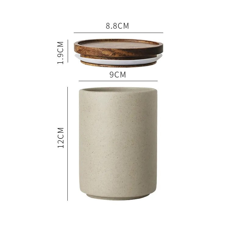 Dimensions of single grey ceramic spice jar with wooden lid on white background