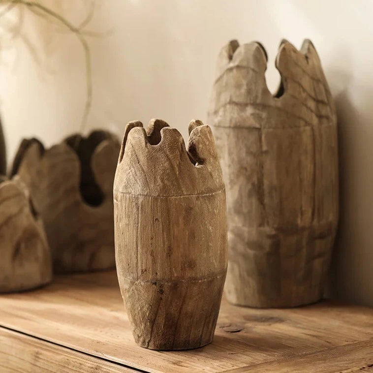 Set of handcrafted japandi wooden vases on wood bench