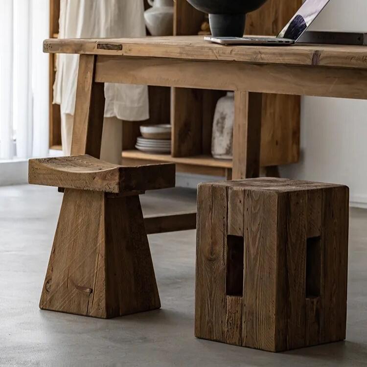 Handcrafted rectangular and triangular wooden side tables in japandi dining room