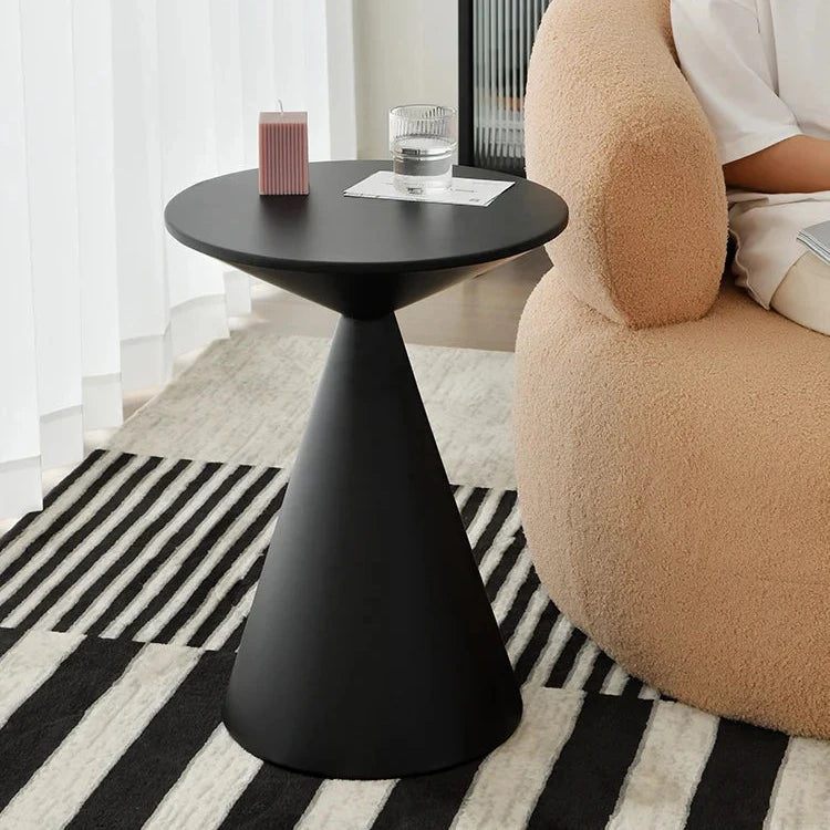 Sleek black lightweight metal side table in minimalist living room