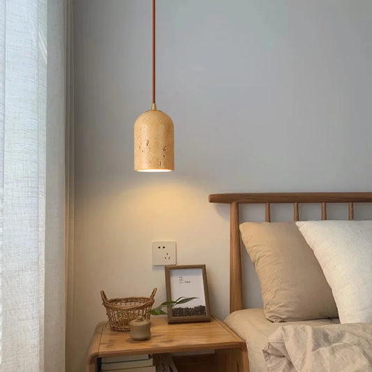 Travertine japandi pendant light hanging over bedside table in neutral color japandi bedroom