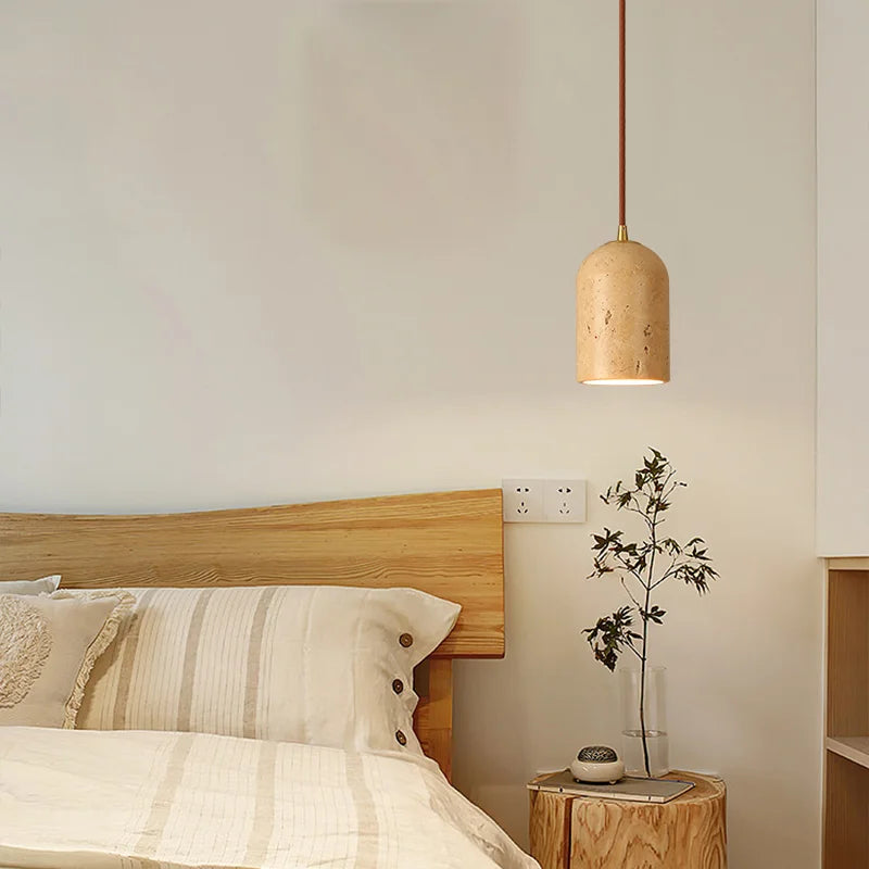 Travertine japandi pendant light hanging over bedside table in neutral color japandi bedroom