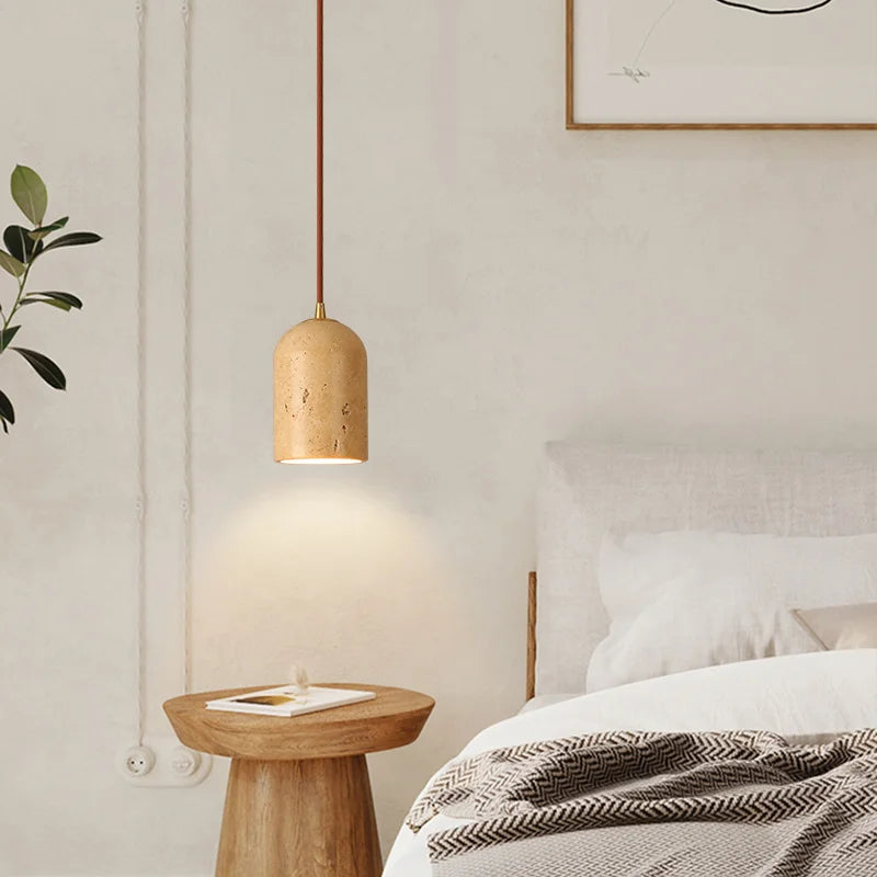 Travertine japandi pendant light hanging over bedside table in neutral color japandi bedroom